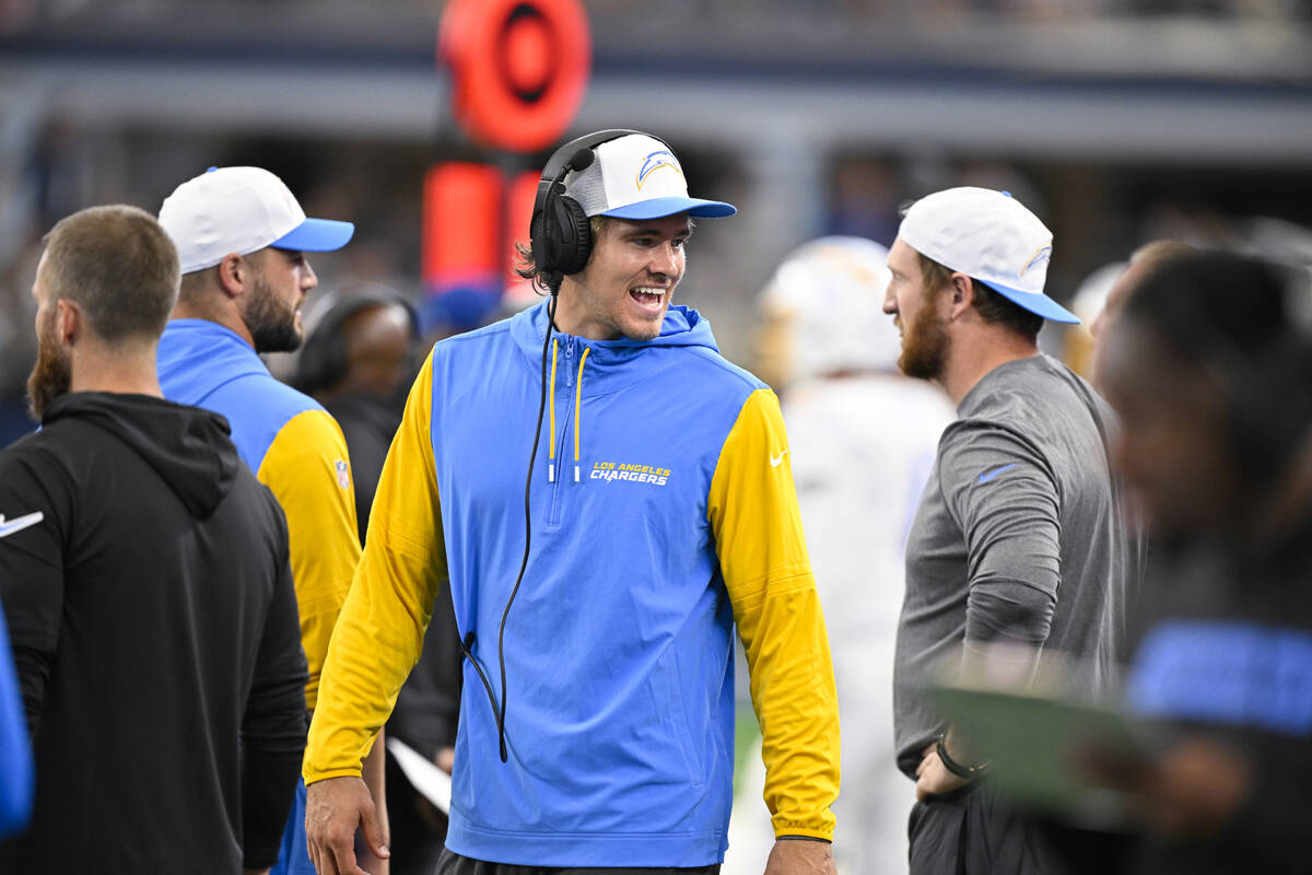 Los Angeles Chargers quarterback Justin Herbert walks the sidelines during an NFL preseason foo ...