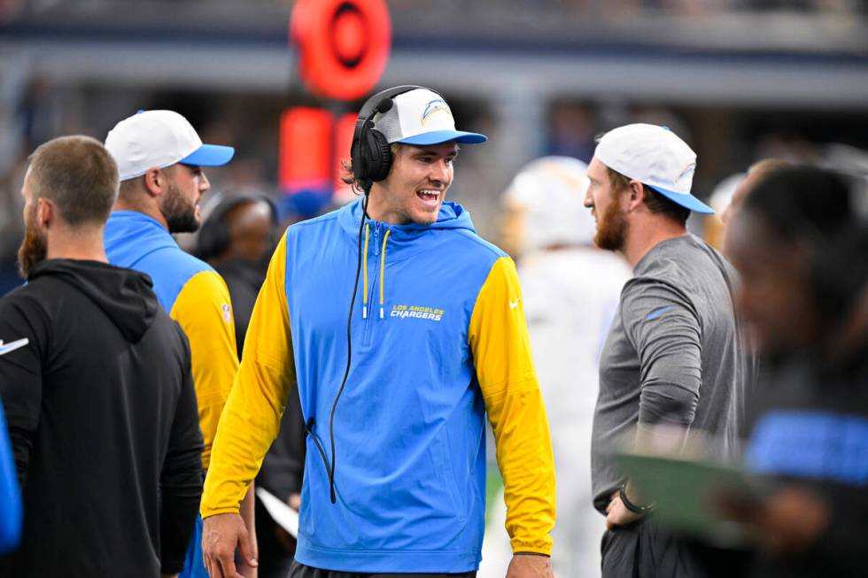 Los Angeles Chargers quarterback Justin Herbert walks the sidelines during an NFL preseason foo ...