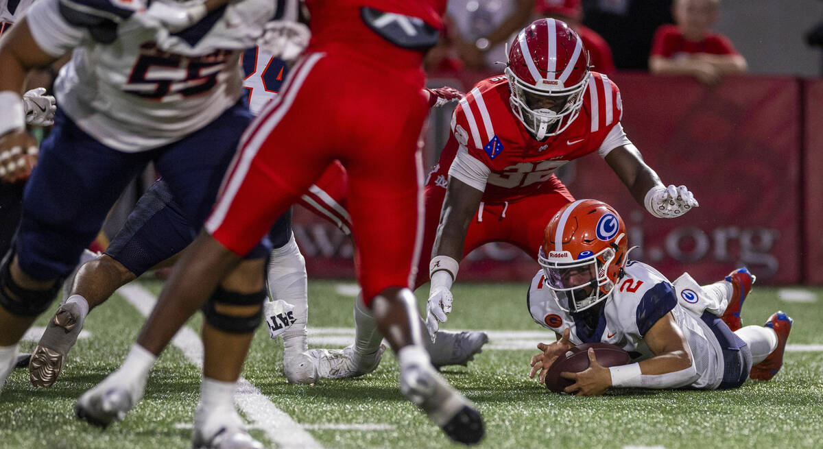 Bishop Gorman quarterback Melvin Spicer IV (2) grabs a fumble against Mater Dei during the firs ...