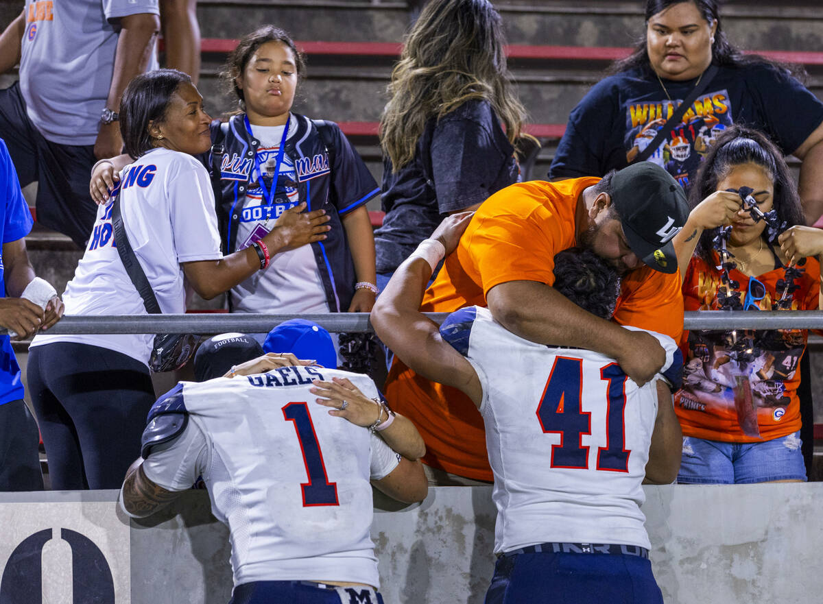 Bishop Gorman linebacker Champ Kapanui (1) and defensive lineman Prince Williams (41) are comfo ...