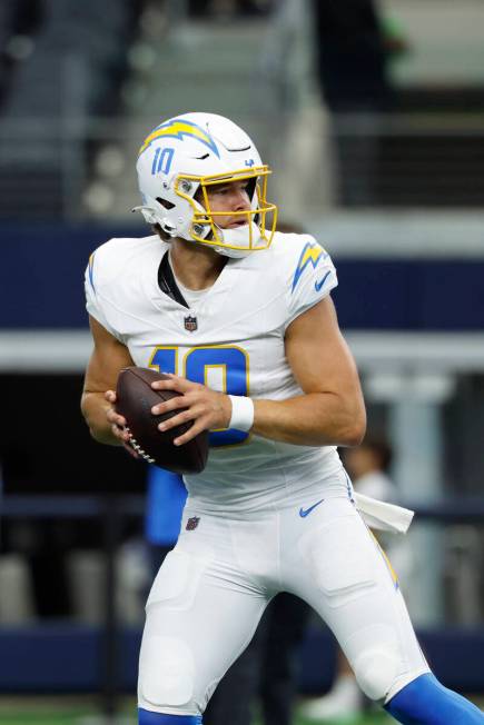 Los Angeles Chargers quarterback Justin Herbert (10) looks to pass during pregame warmups befor ...