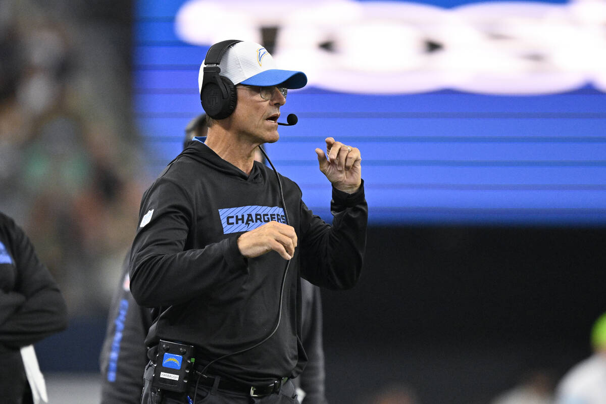 Los Angeles Chargers head coach Jim Harbaugh walks the sidelines during an NFL preseason footba ...