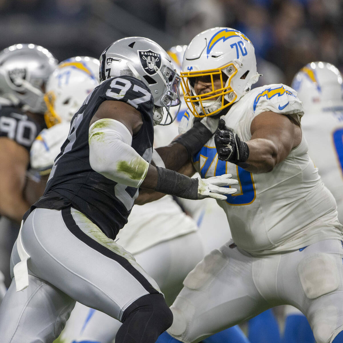 Raiders defensive end Janarius Robinson (97) defends against Los Angeles Chargers offensive tac ...