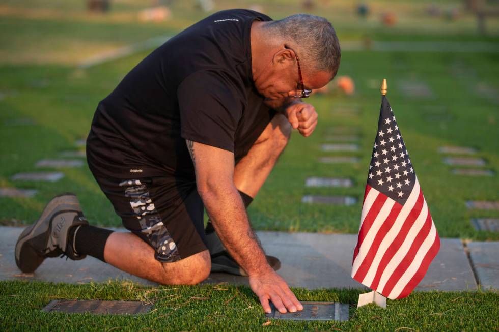 Carlos Gurri visits the grave of former FBI Special Agent John Bailey at Palm Eastern Mortuary, ...