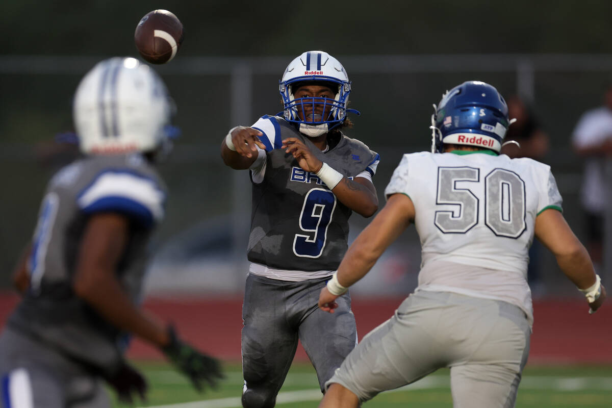 Basic quarterback Jayveon Rose (9) passes the ball up the field against Green Valley’s d ...