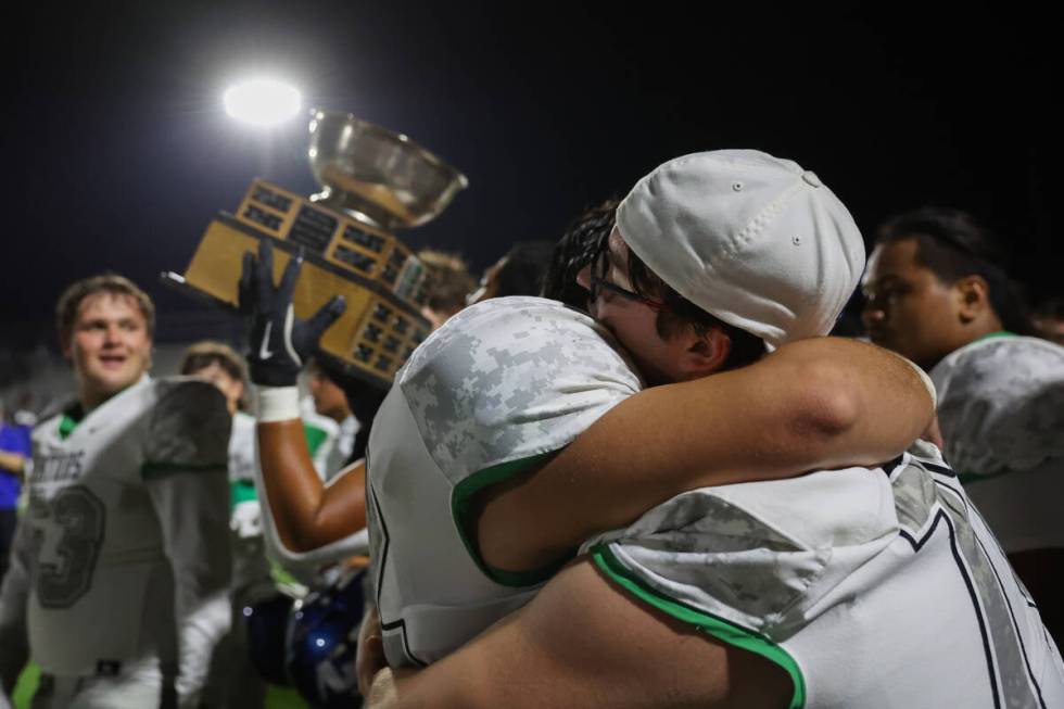 Green Valley celebrates after winning a rivalry high school football game against Basic at Basi ...