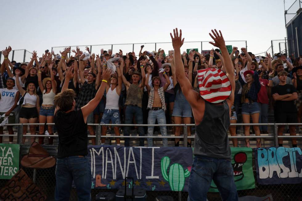 Basic fans cheer for their team during a high school football game against Green Valley at Basi ...