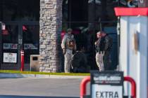 Metro law enforcement stand outside of a Speedway gas station on South Maryland Parkway on Frid ...