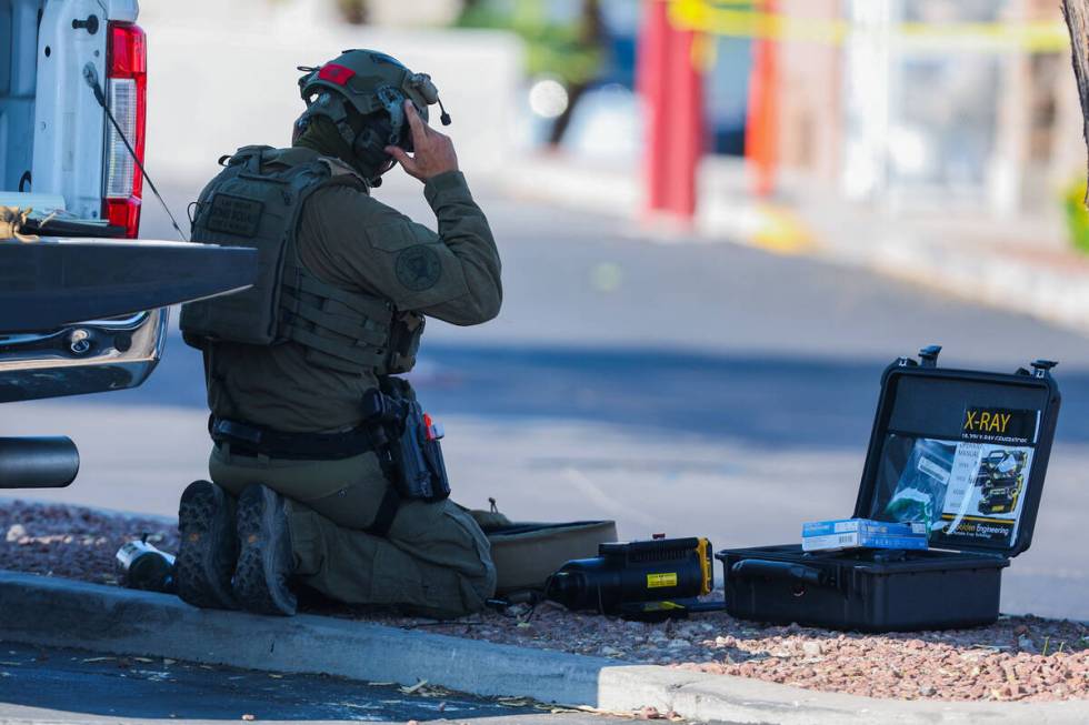 An officer with the Las Vegas bomb squad works outside of a Speedway gas station on South Maryl ...