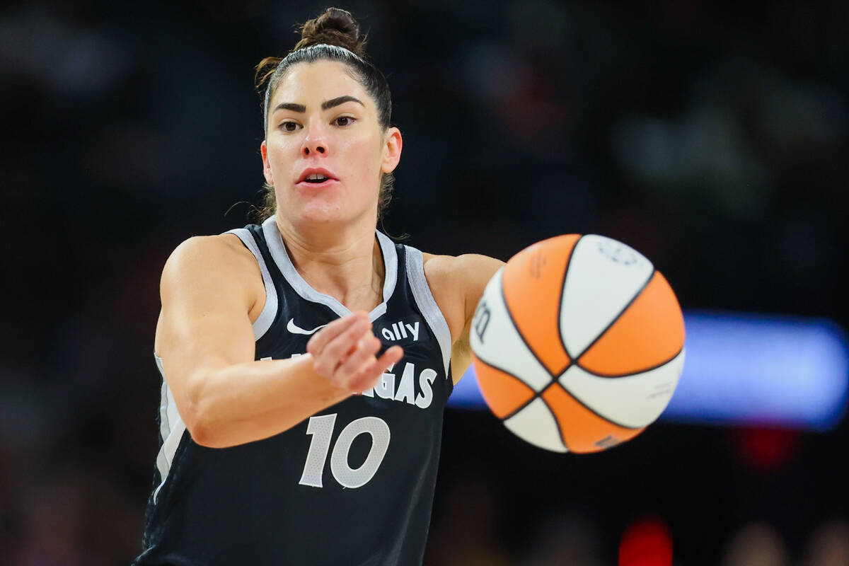 Aces guard Kelsey Plum (10) passes the ball to a teammate during a WNBA basketball game between ...