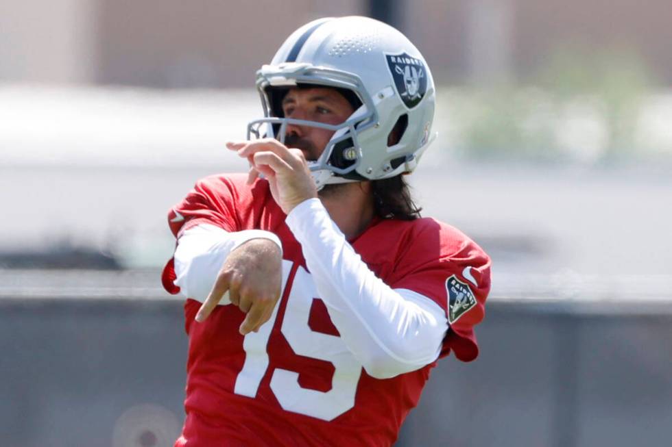 Raiders quarterbacks Gardner Minshew (15) watches his throw during practice at the Intermountai ...