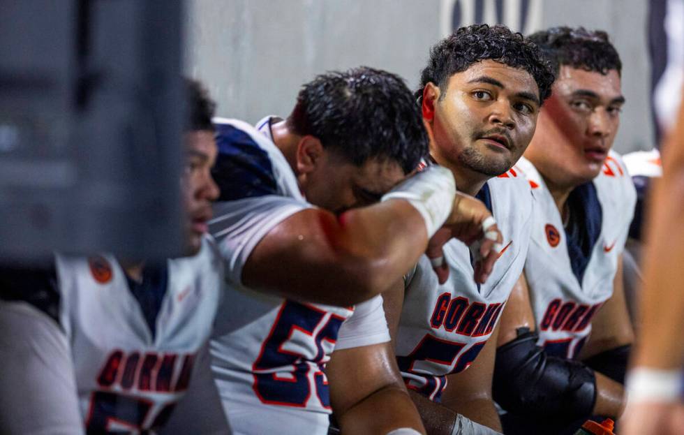 Bishop Gorman players are a bit dejected on the bench as Mater Dei dominates during the second ...