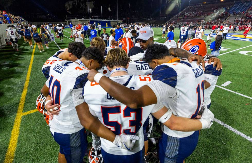 Bishop Gorman players gather together after a loss to Mater Dei in their high school football g ...