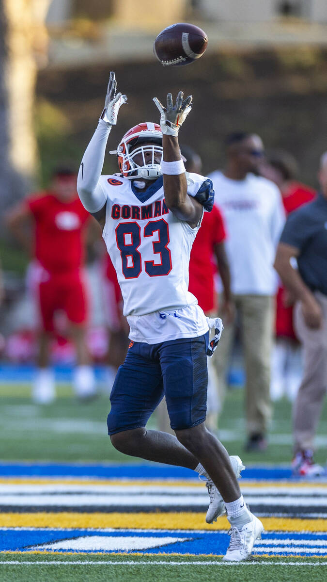 Bishop Gorman wide receiver Avion Kaiser (83) catches a pass as they warm up to face Mater Dei ...