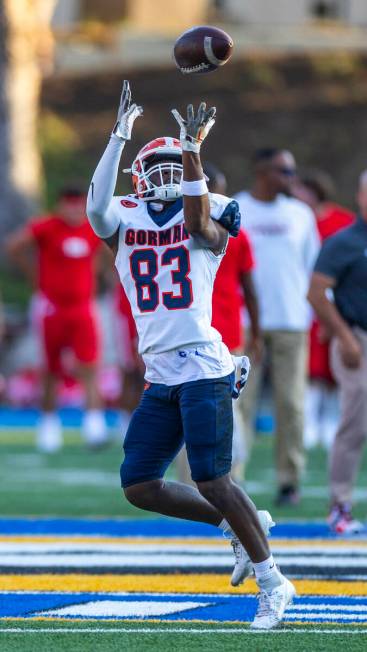 Bishop Gorman wide receiver Avion Kaiser (83) catches a pass as they warm up to face Mater Dei ...