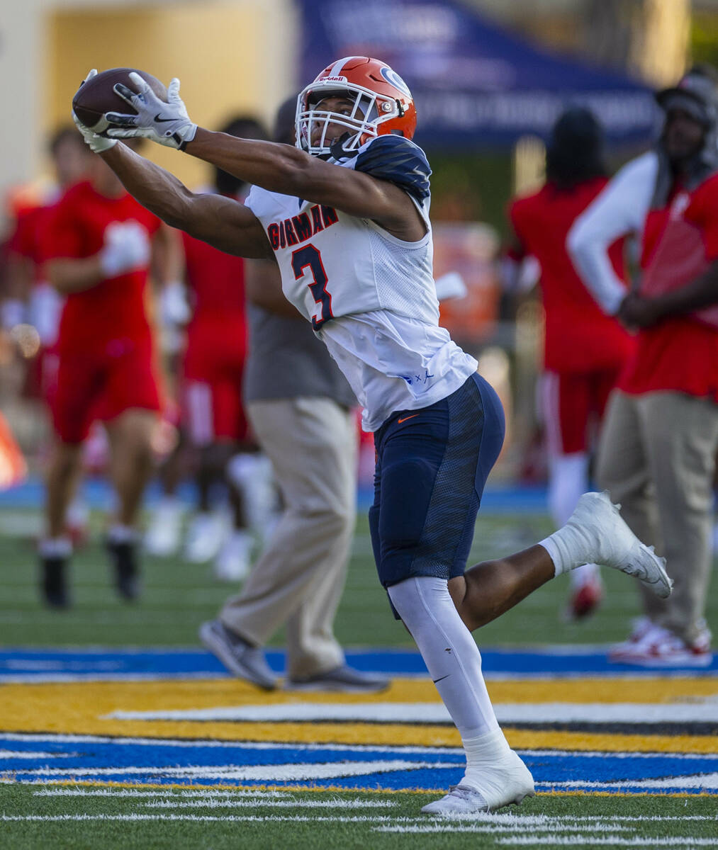 Bishop Gorman running back Terrance Grant (3) catches a pass as they warm up to face Mater Dei ...