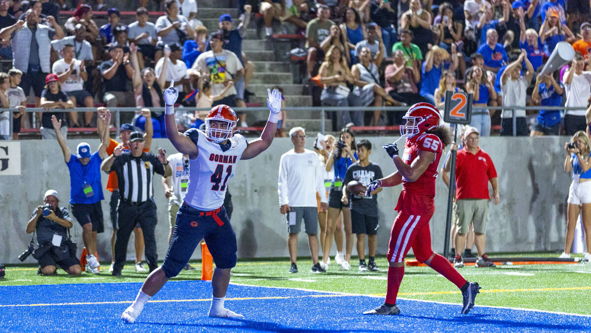 Bishop Gorman defensive lineman James Carrington (58) sacks Mater Dei quarterback Ashton Beierl ...