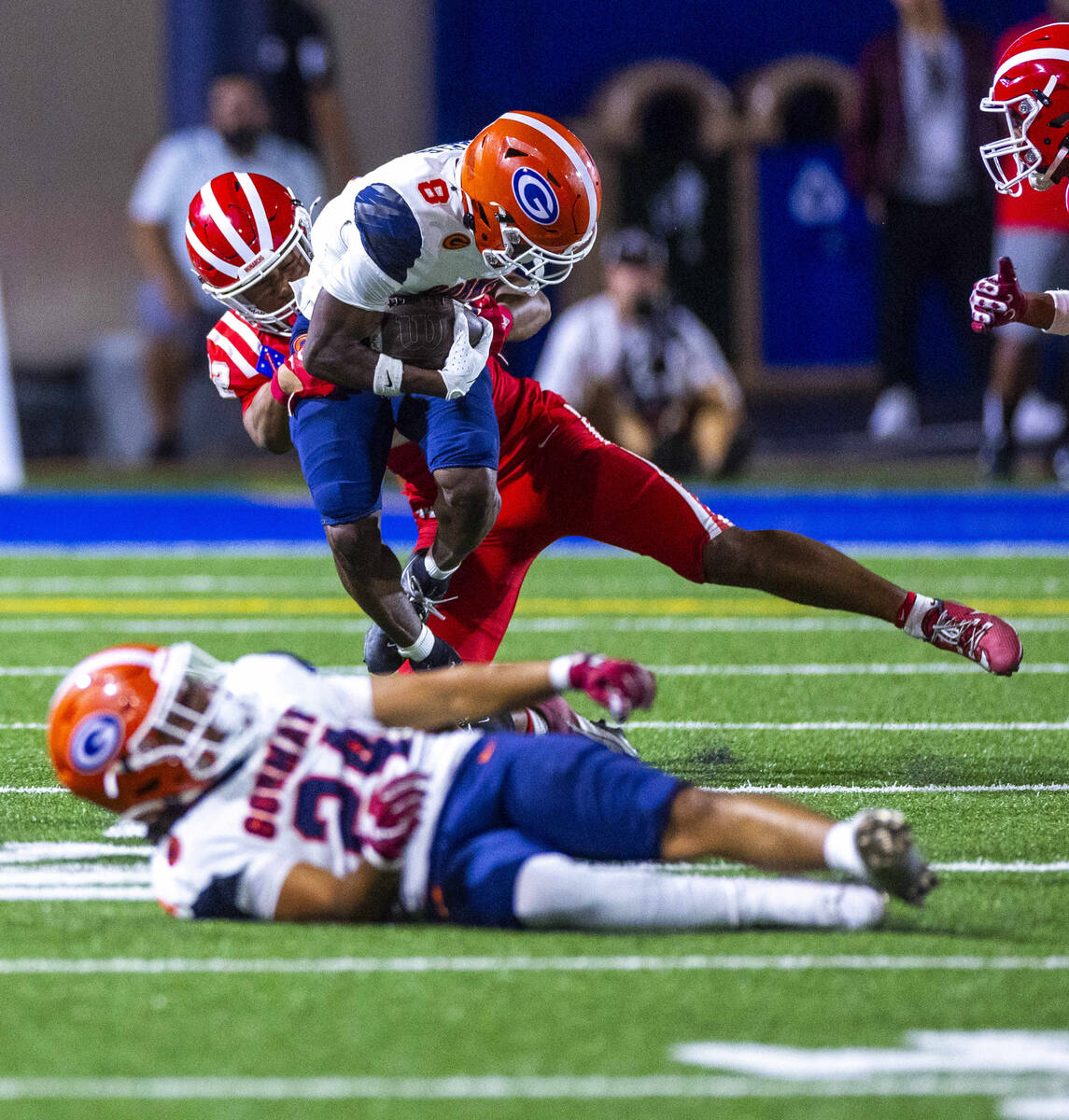 Bishop Gorman wide receiver Greg Toler (8) is caught from behind by Mater Dei defensive back Ac ...