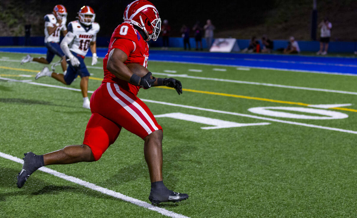 Mater Dei running back Jordon Davison (0) looks to beat Bishop Gorman linebacker Tamatoa Gaoteo ...