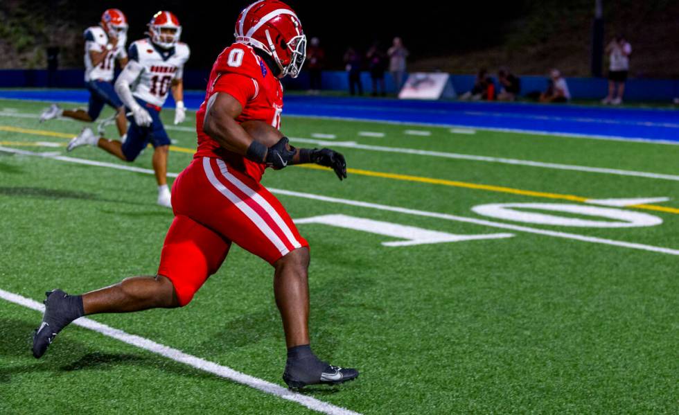 Mater Dei running back Jordon Davison (0) looks to beat Bishop Gorman linebacker Tamatoa Gaoteo ...