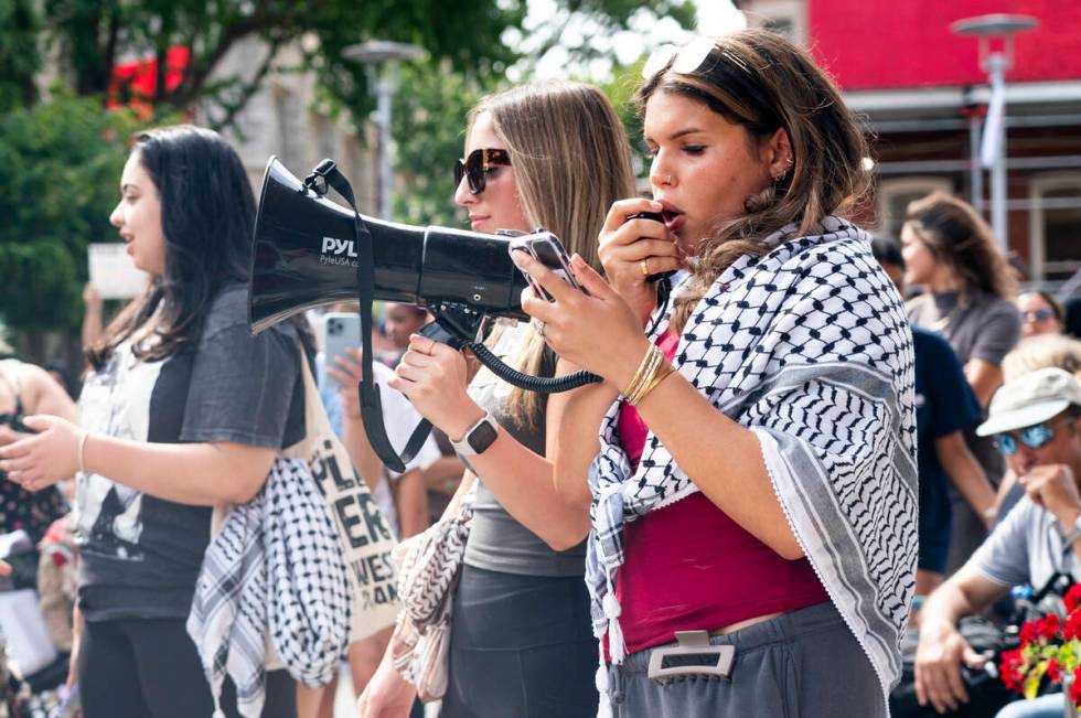 Alia Amanpour Trapp, right, talks to the crowd during a pro-Palestine rally and march on Temple ...