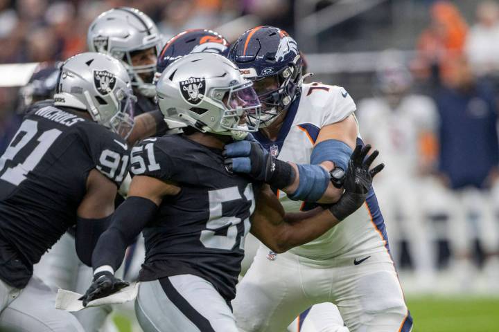 Raiders defensive end Malcolm Koonce (51) works past Denver Broncos offensive tackle Garett Bol ...