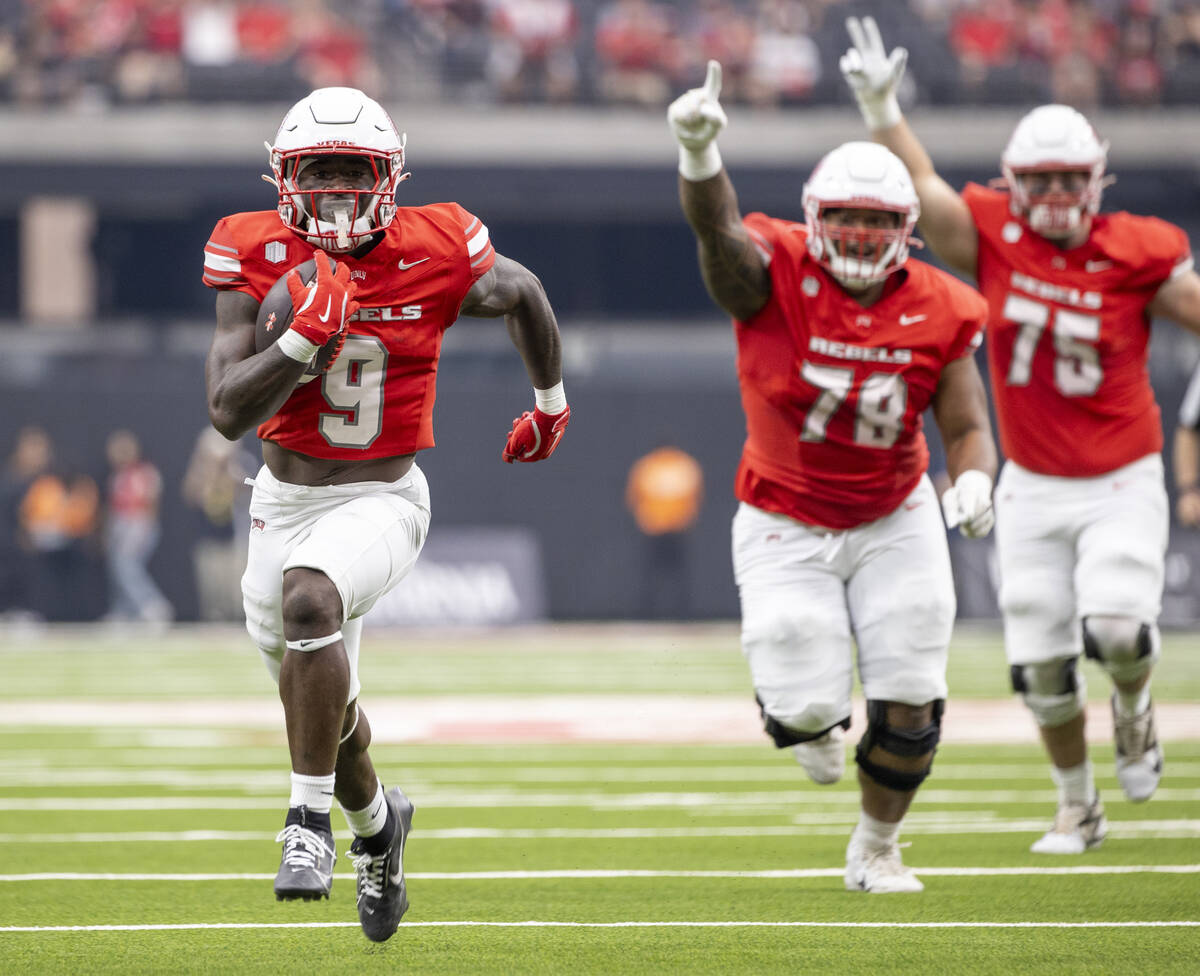 UNLV running back Jai'Den Thomas (9) runs for a touchdown during the first half of the college ...