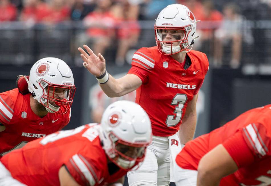 UNLV quarterback Matthew Sluka (3) directs the offensive line during the college football game ...