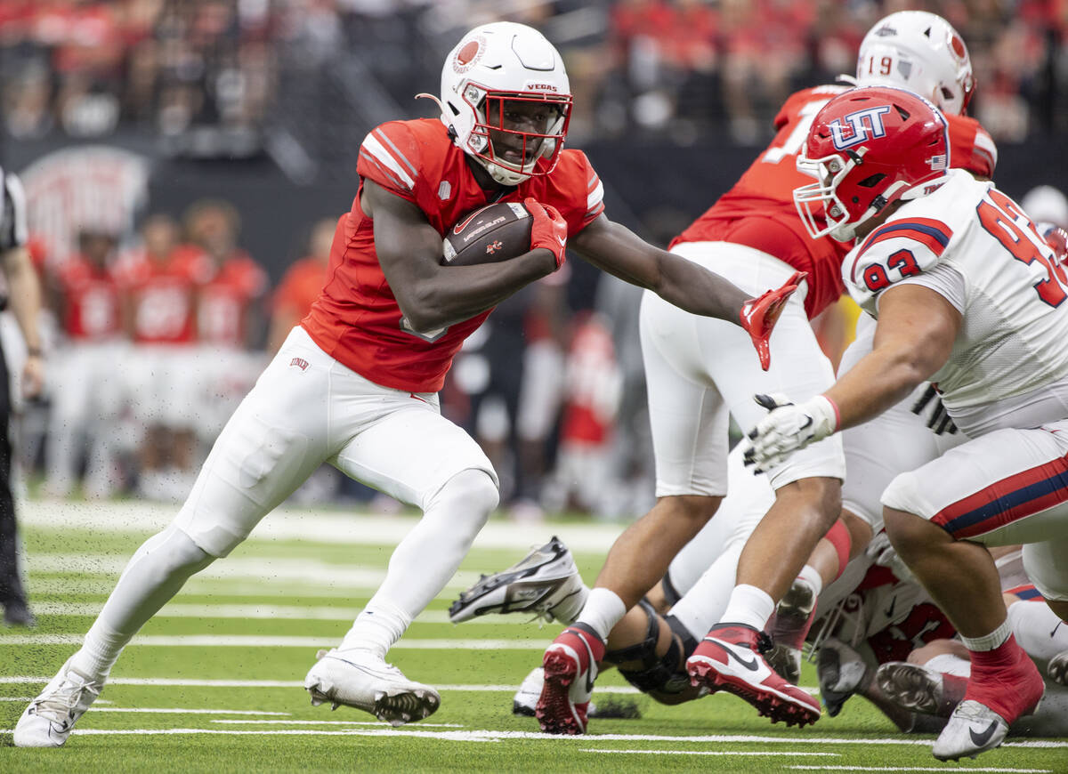 UNLV running back Greg Burrell (5) runs with the ball during the college football game against ...