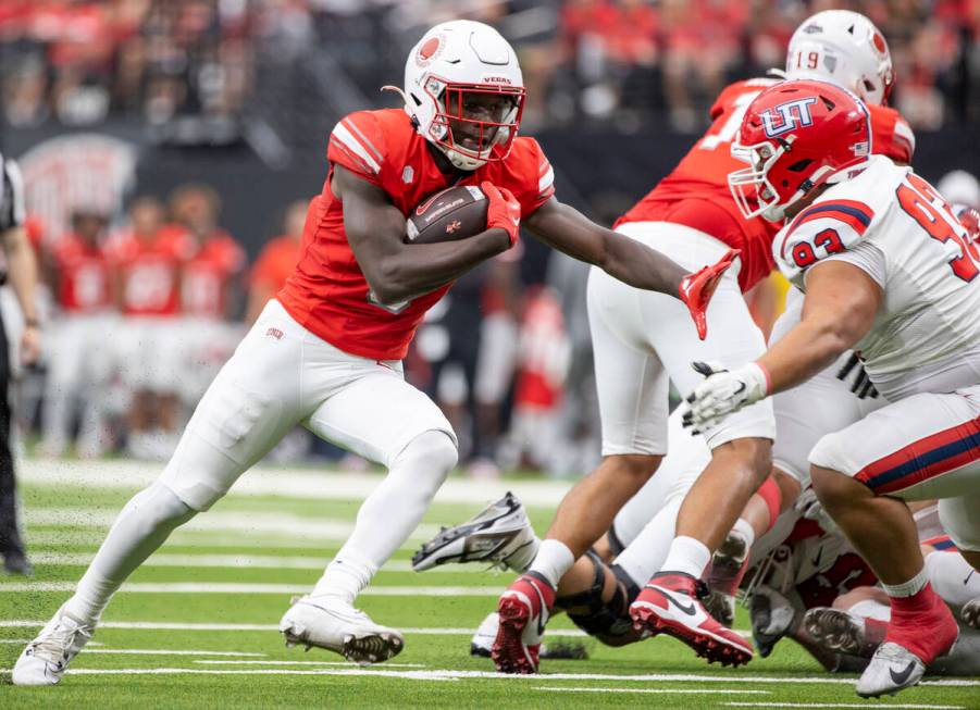 UNLV running back Greg Burrell (5) runs with the ball during the college football game against ...