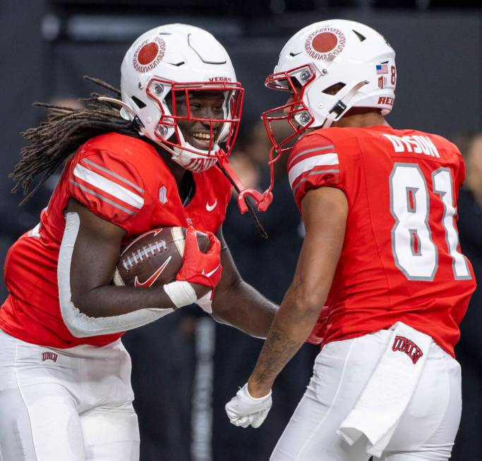 UNLV running back Devin Green (22) celebrates his touchdown with wide receiver Traivon Dyson (8 ...