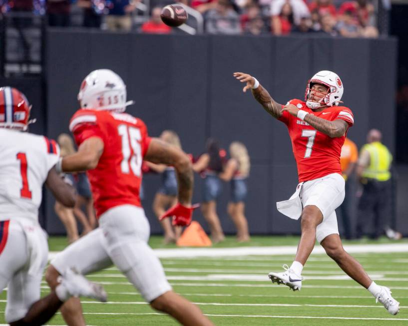 UNLV quarterback Cameron Friel (7) passes the ball while on the run during the college football ...