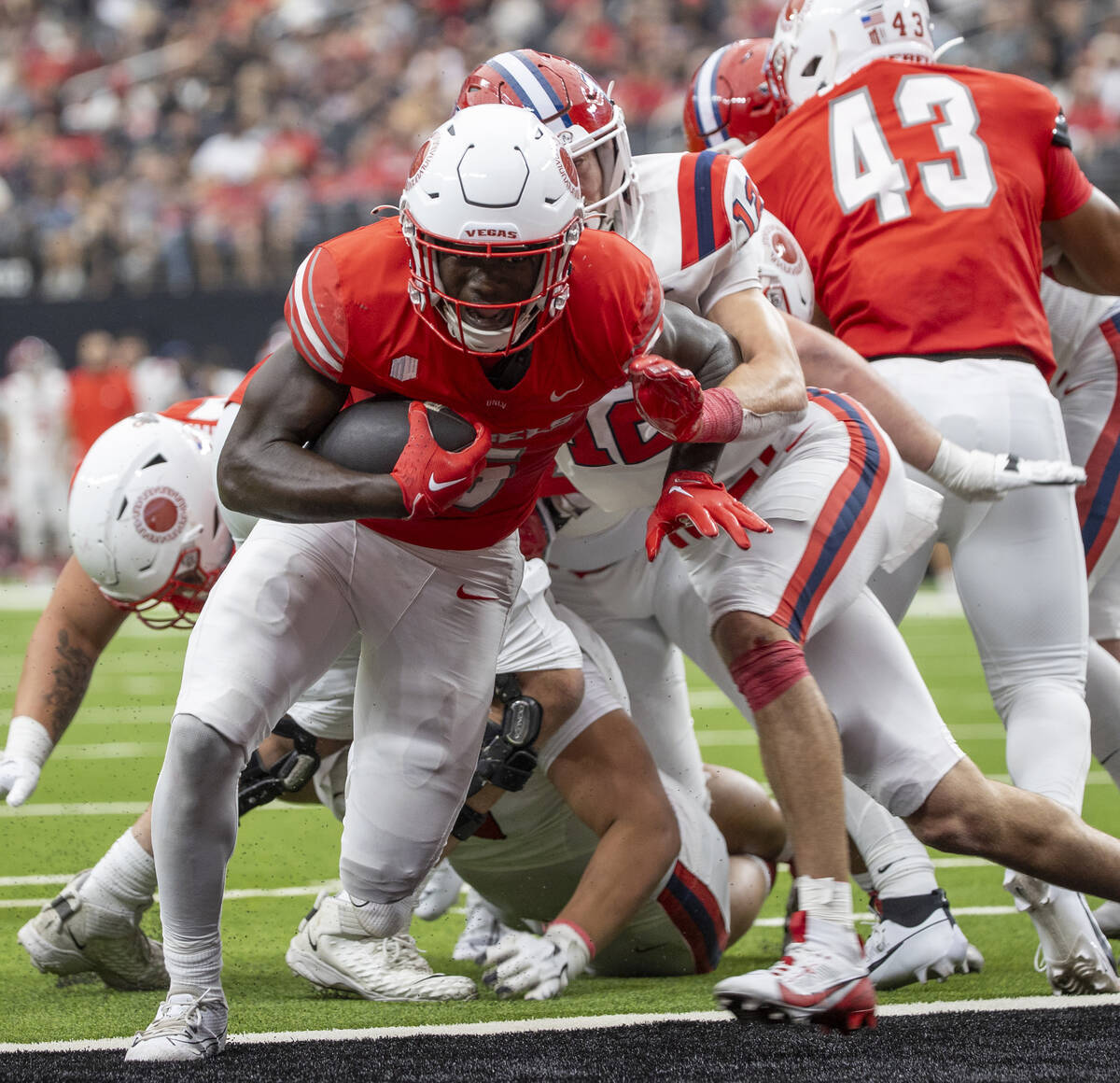 UNLV running back Greg Burrell (5) scores a rushing touchdown during the college football game ...