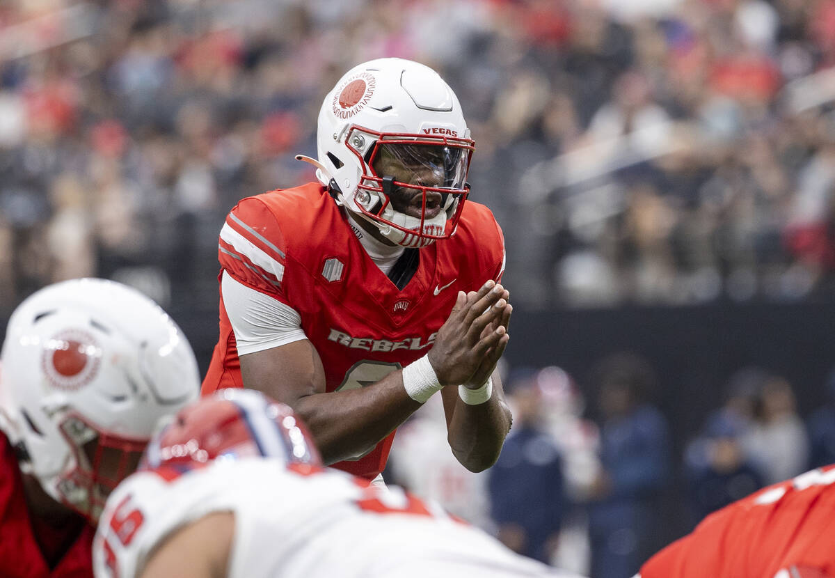 UNLV quarterback Hajj-Malik Williams (6) prepares to snap the ball during the college football ...