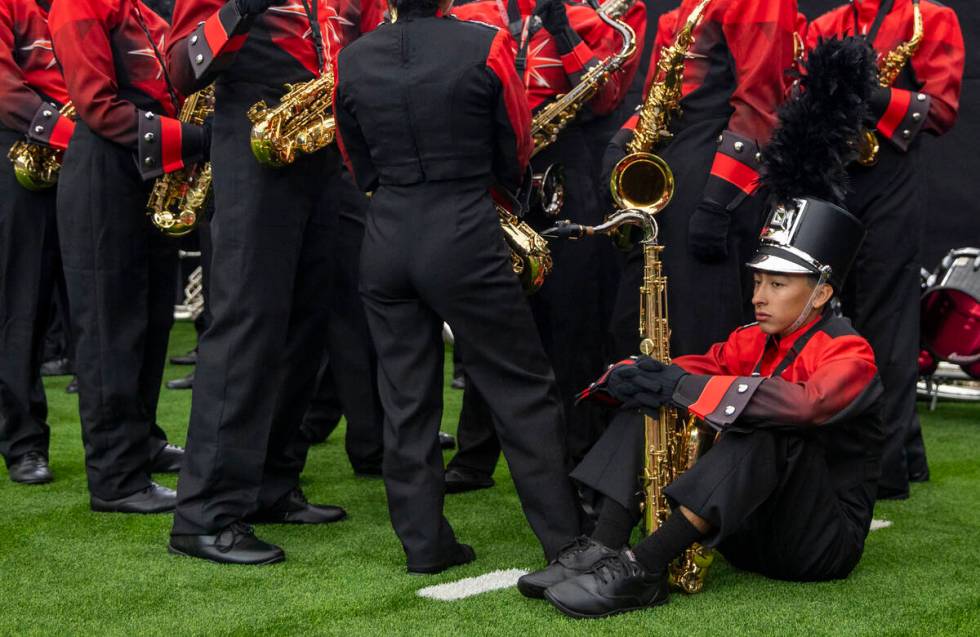 Members of the UNLV Star of Nevada Marching Band wait to take the field before halftime during ...