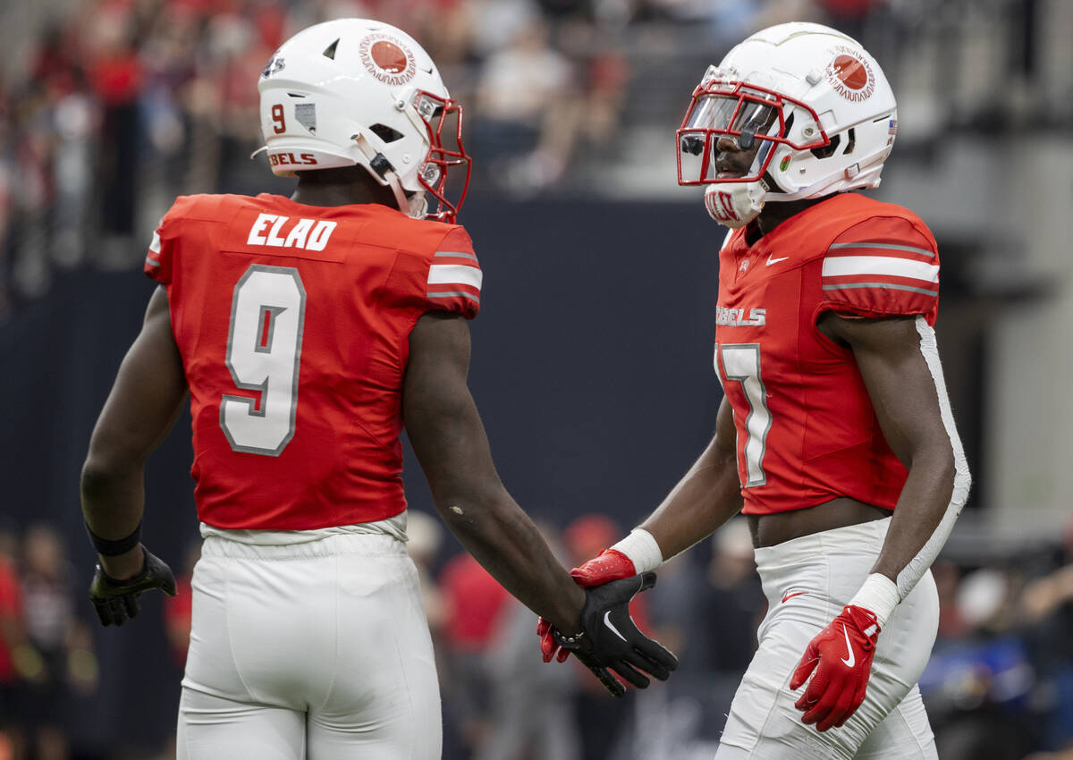 UNLV defensive back Jett Elad (9) and defensive back La'Vario Wiley (17) high-five during the c ...