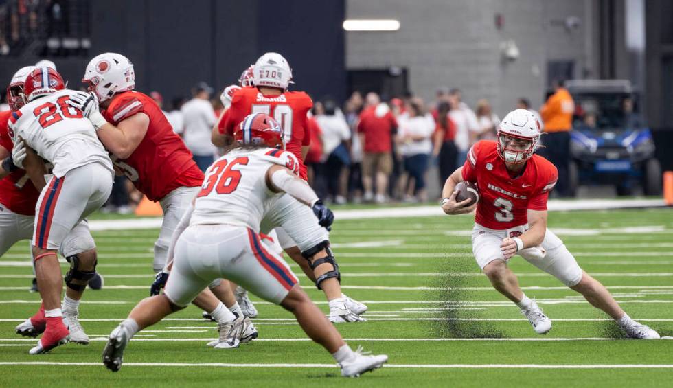 UNLV quarterback Matthew Sluka (3) runs with the ball during the college football game against ...