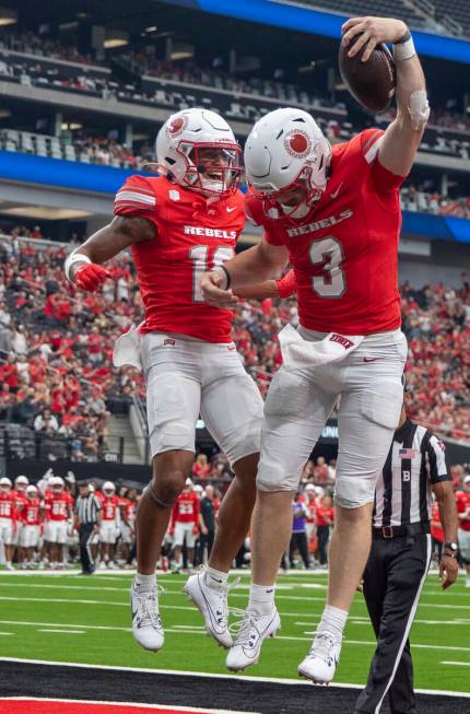 UNLV wide receiver DeAngelo Irvin Jr. (10) and quarterback Matthew Sluka (3) celebrate Sluka&#x ...