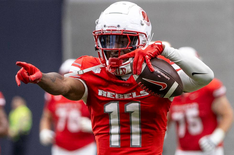 UNLV wide receiver Ricky White III (11) celebrates after catching a deep pass during the colleg ...