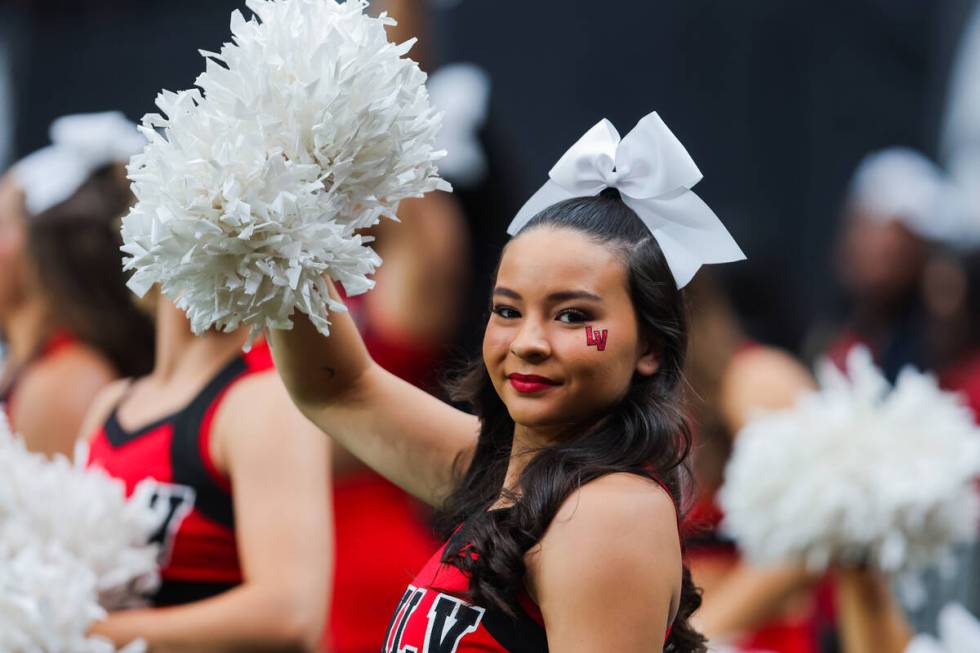 A UNLV cheerleader cheers for her team during an NCAA football game between UNLV and Utah Tech ...