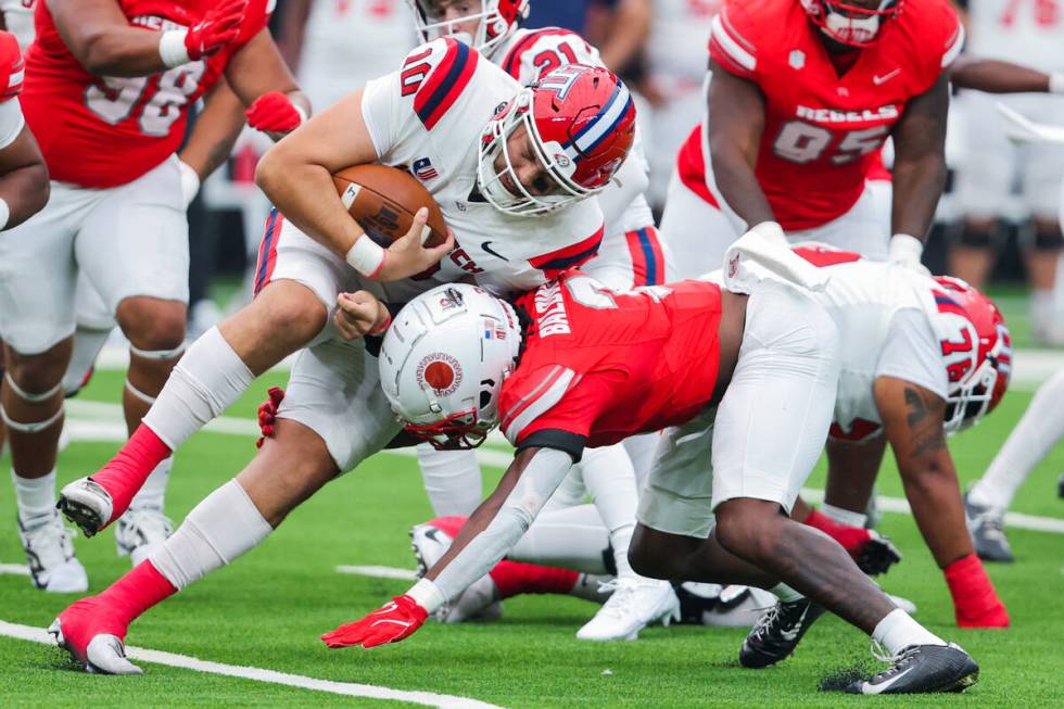 Utah Tech Trailblazers quarterback Deacon Hill (10) struggles to gain a yard during an NCAA foo ...