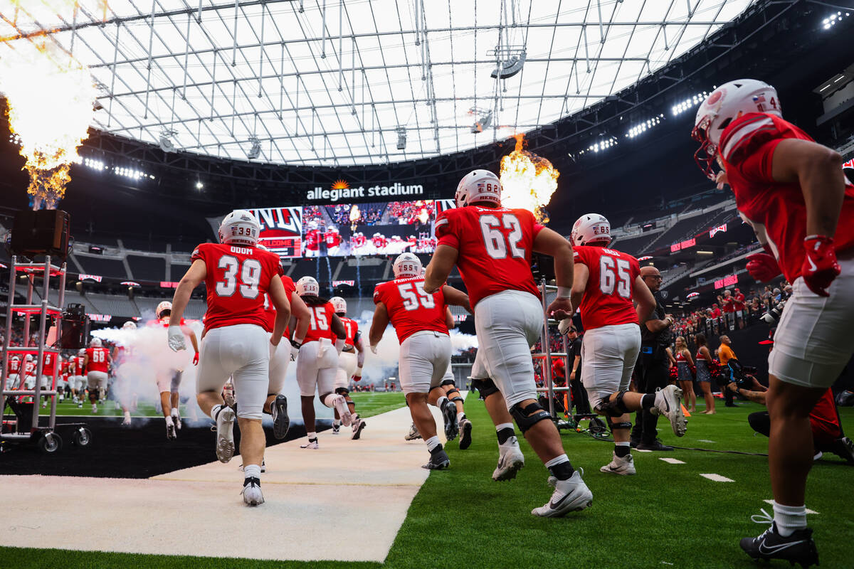 UNLV makes their way onto the field during an NCAA football game between UNLV and Utah Tech at ...