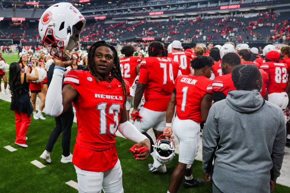 UNLV Rebels defensive back Jarvis Ware (13) raises his helmet to the stands during an NCAA foot ...