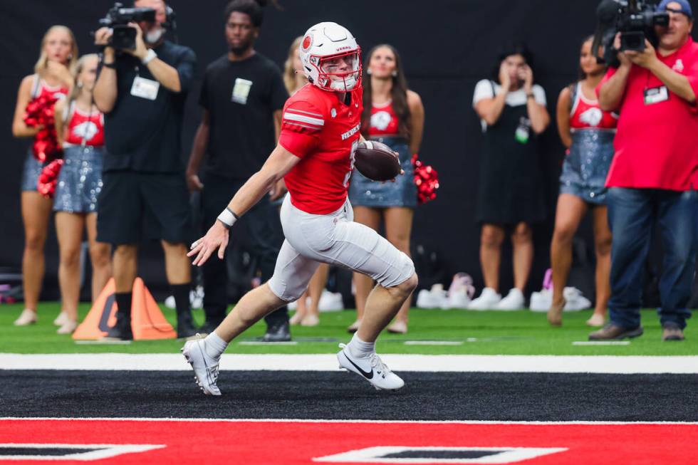 UNLV quarterback Matthew Sluka (3) runs into the end zone for a touchdown during an NCAA footba ...