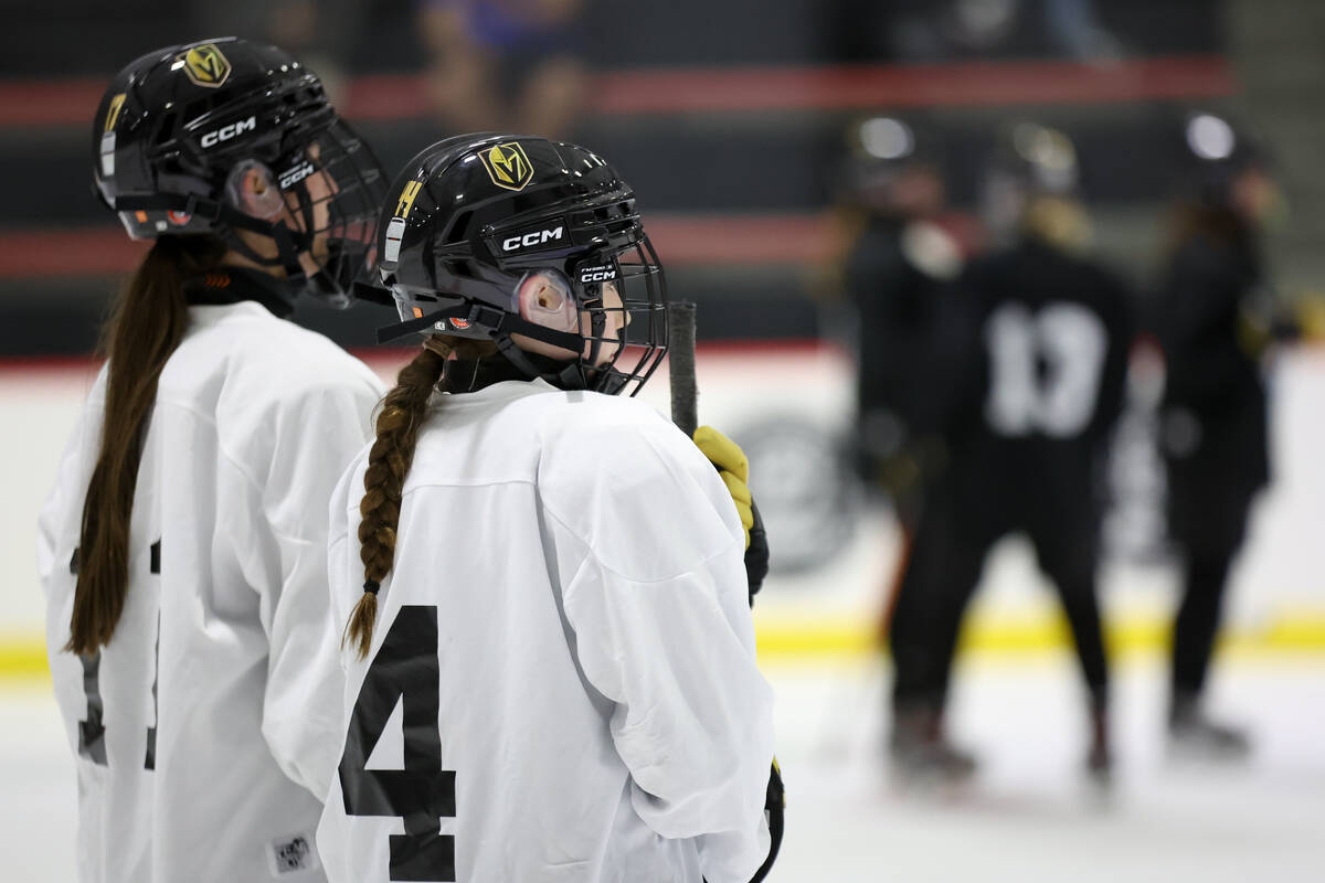 Vegas Jr. Golden Knights 14U Girls team players watch drills during practice at America First C ...