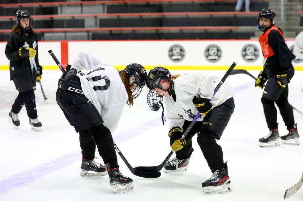 Vegas Jr. Golden Knights 14U Girls team players fake a face off during practice at America Firs ...