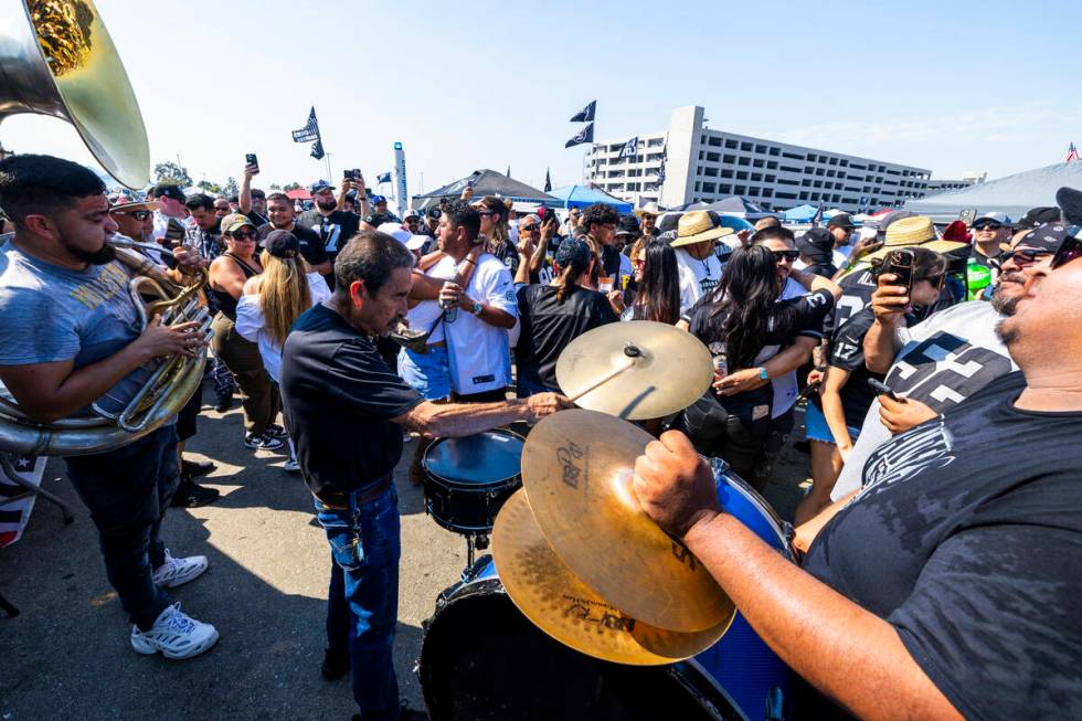 A band plays as fans dance in the tailgate area before the Raiders face the Los Angeles Charger ...