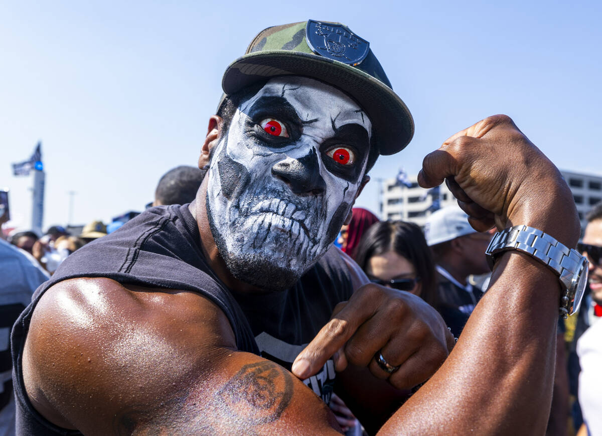 A fan shows off his Raiders tattoo in the tailgate area before the Raiders face the Los Angeles ...