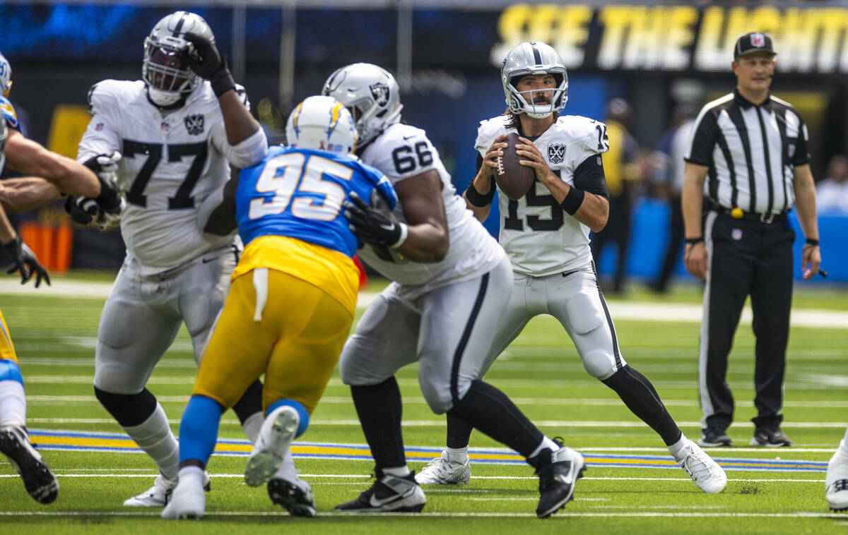 Raiders quarterback Gardner Minshew (15) looks to pass against the Los Angeles Chargers during ...