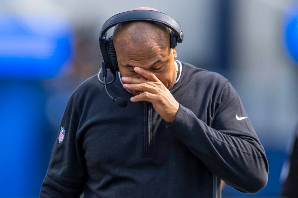 Raiders head coach Antonio Pierce walks dejected on the sidelines after a late failed drive dur ...